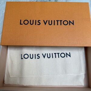 Louis Vuitton boxes and shopping bags and ribbon